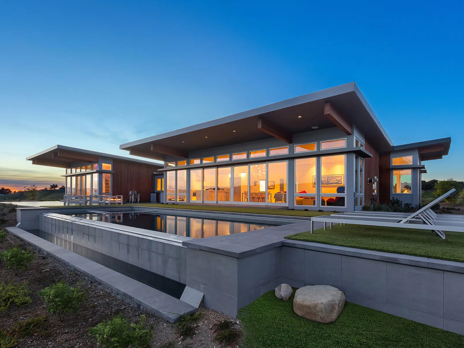 Illustrative reference of a modern prefab residence with a broad roofline